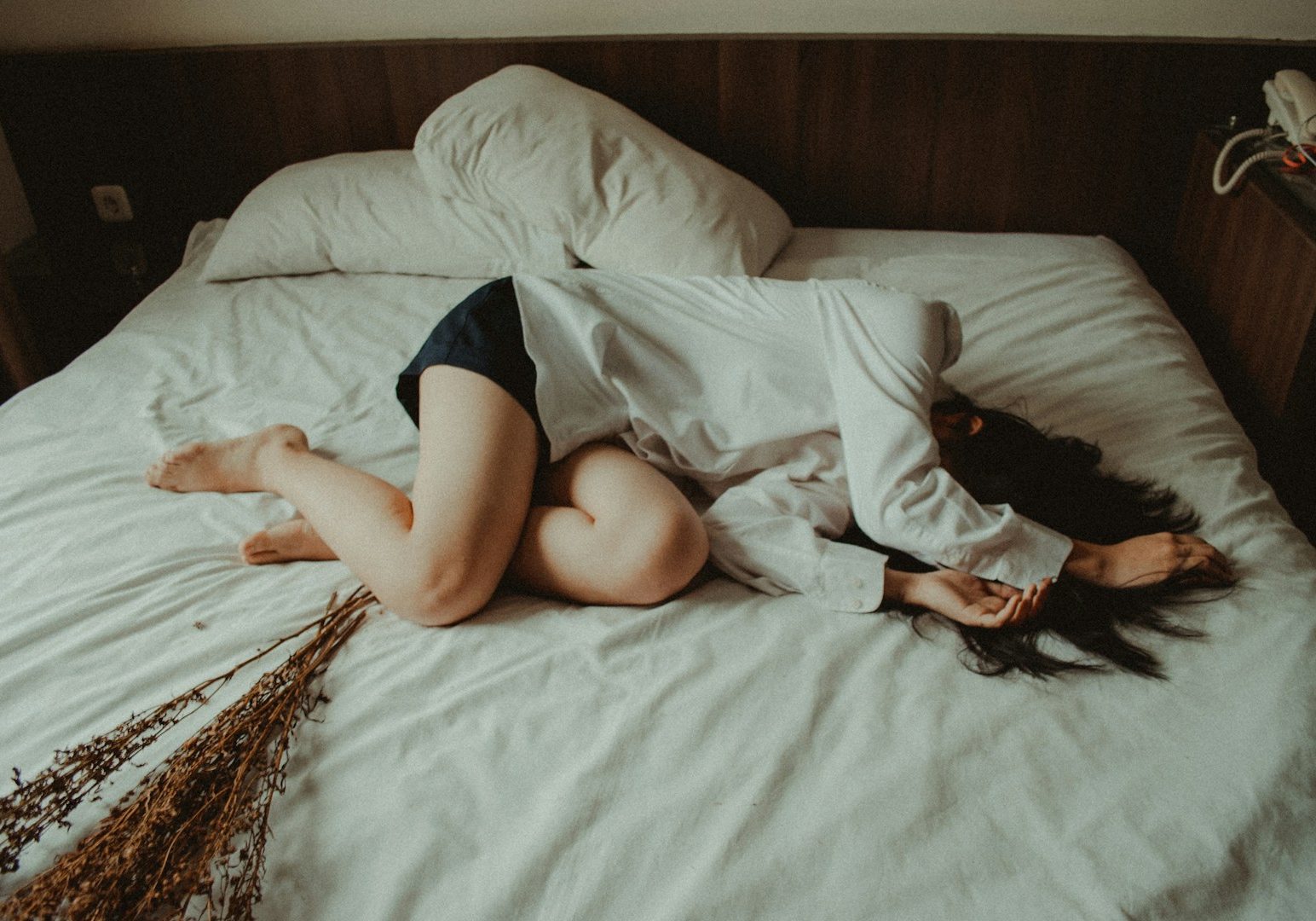 woman lying on bed